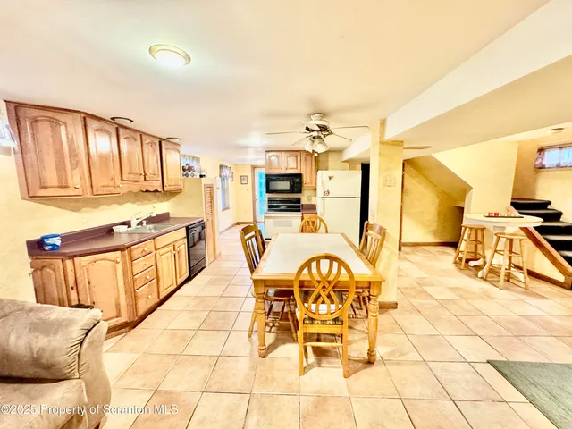 a living room with a table and chairs