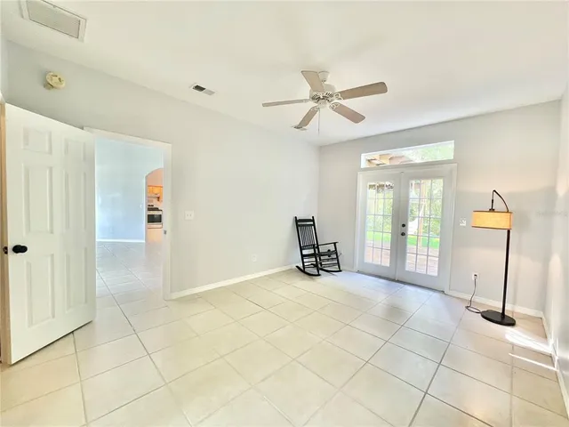 a view of a livingroom with a furniture and a ceiling fan