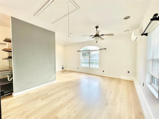 a view of a room with a ceiling fan