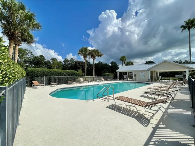 a view of a swimming pool with a patio