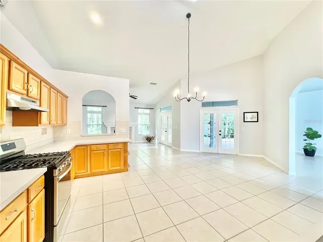 a view of an empty room and window with a swimming pool