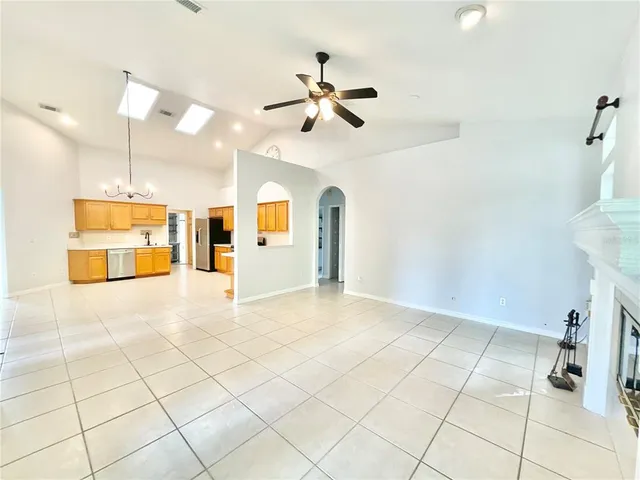 a view of a livingroom with a furniture and ceiling fan
