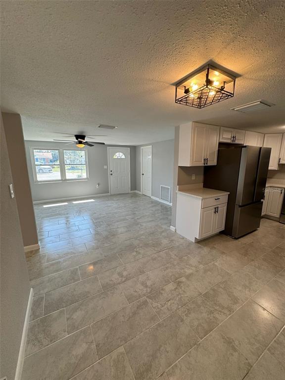 7615 Marechal Avenue Port Richey, FL 34668 - Photo 6 of 33 Living Room + Dining Room Combo