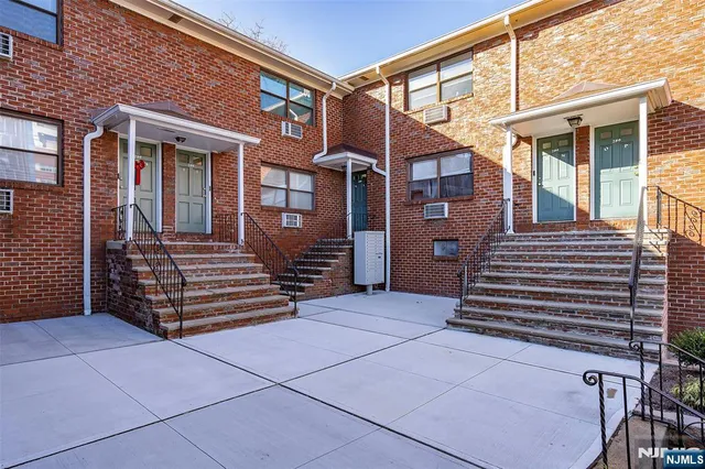 a front view of a house with stairs