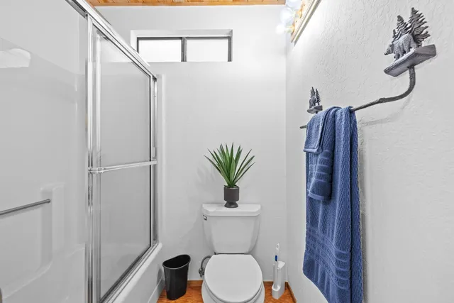 a room with furniture a rug and a window