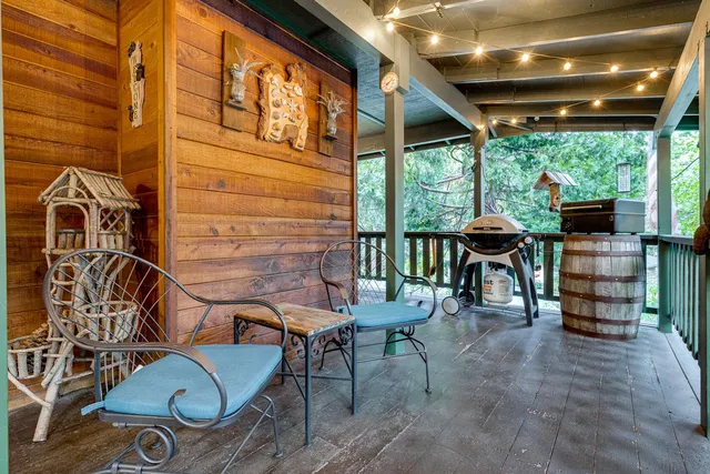 a view of a chairs and table in the patio