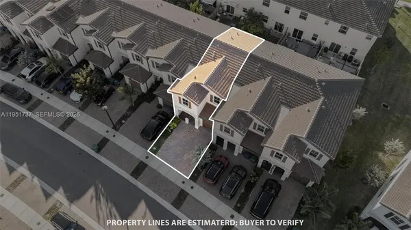 an aerial view of a house with outdoor space patio and outdoor seating