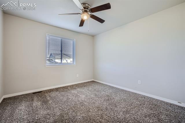 6126 Jorie Road Colorado Springs, CO 80927 - Photo 14 of 28 Carpeted empty room with ceiling fan