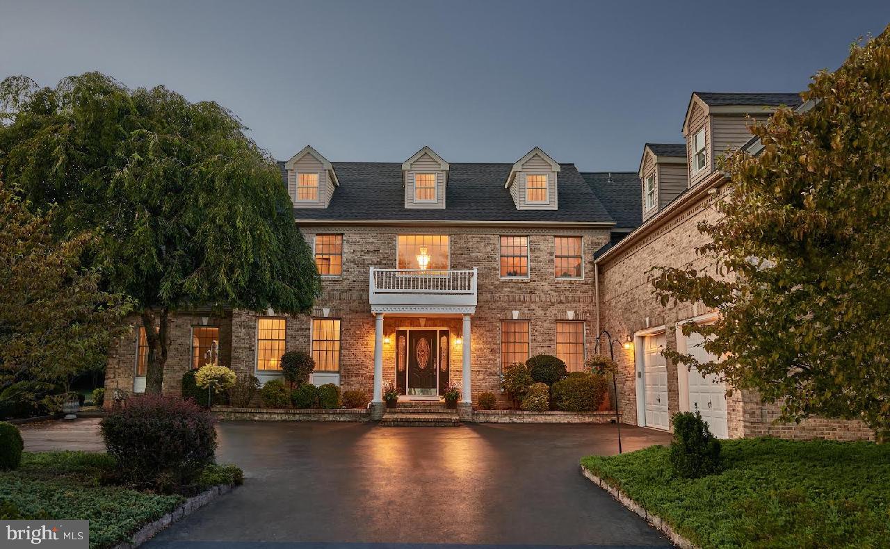 8 Carney Way Hamilton, NJ 08620 - Photo 1 of 66 Elegant stone facade at twilight.