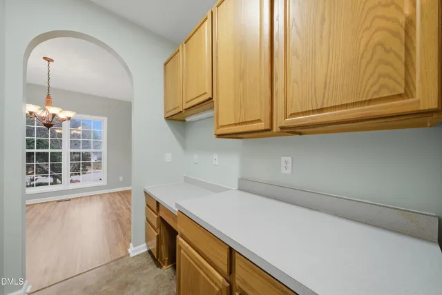 a kitchen with stainless steel appliances a stove microwave and refrigerator