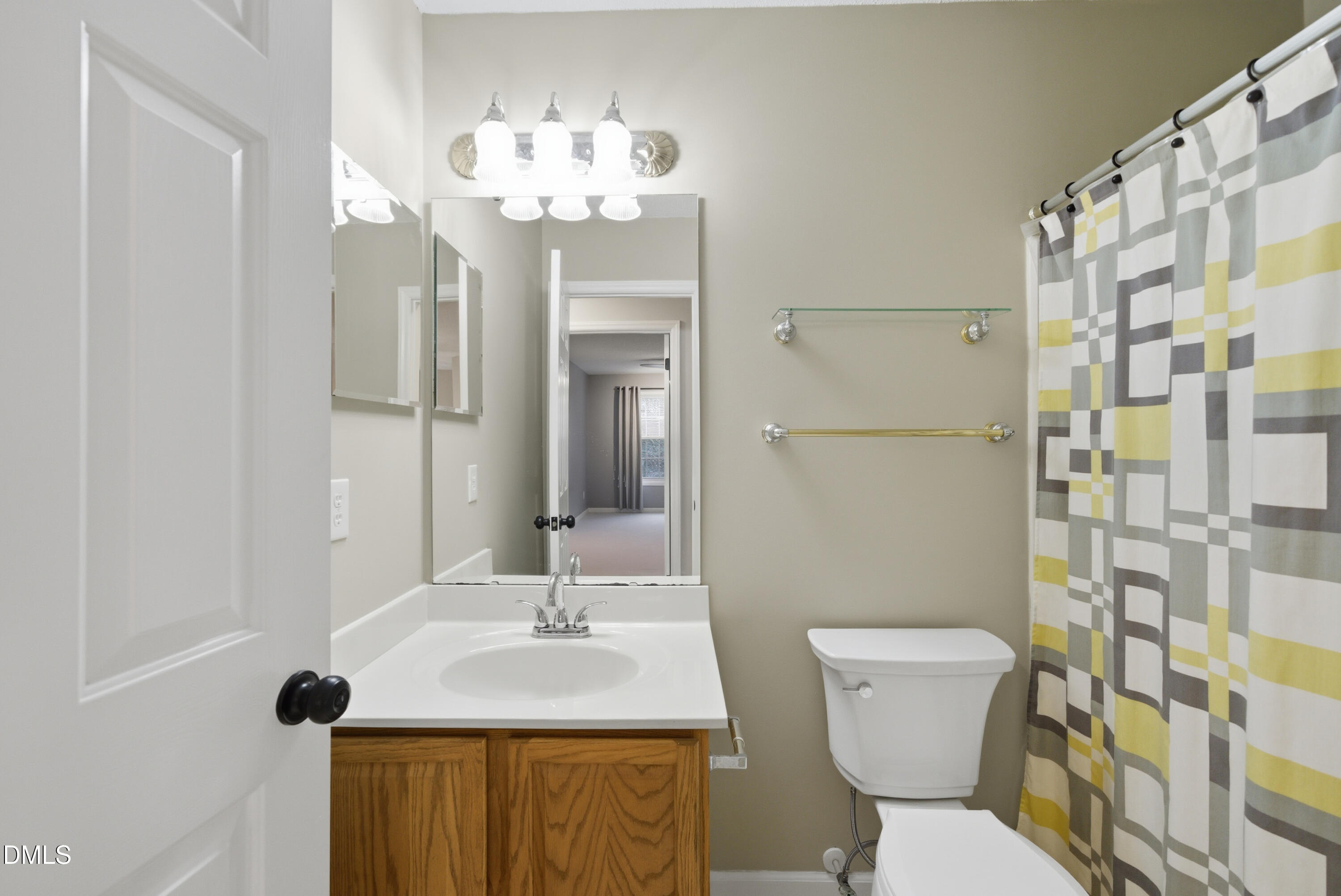 3100 Countryman Court Wake Forest, NC 27587 - Photo 32 of 42 a bathroom with a toilet sink and mirror