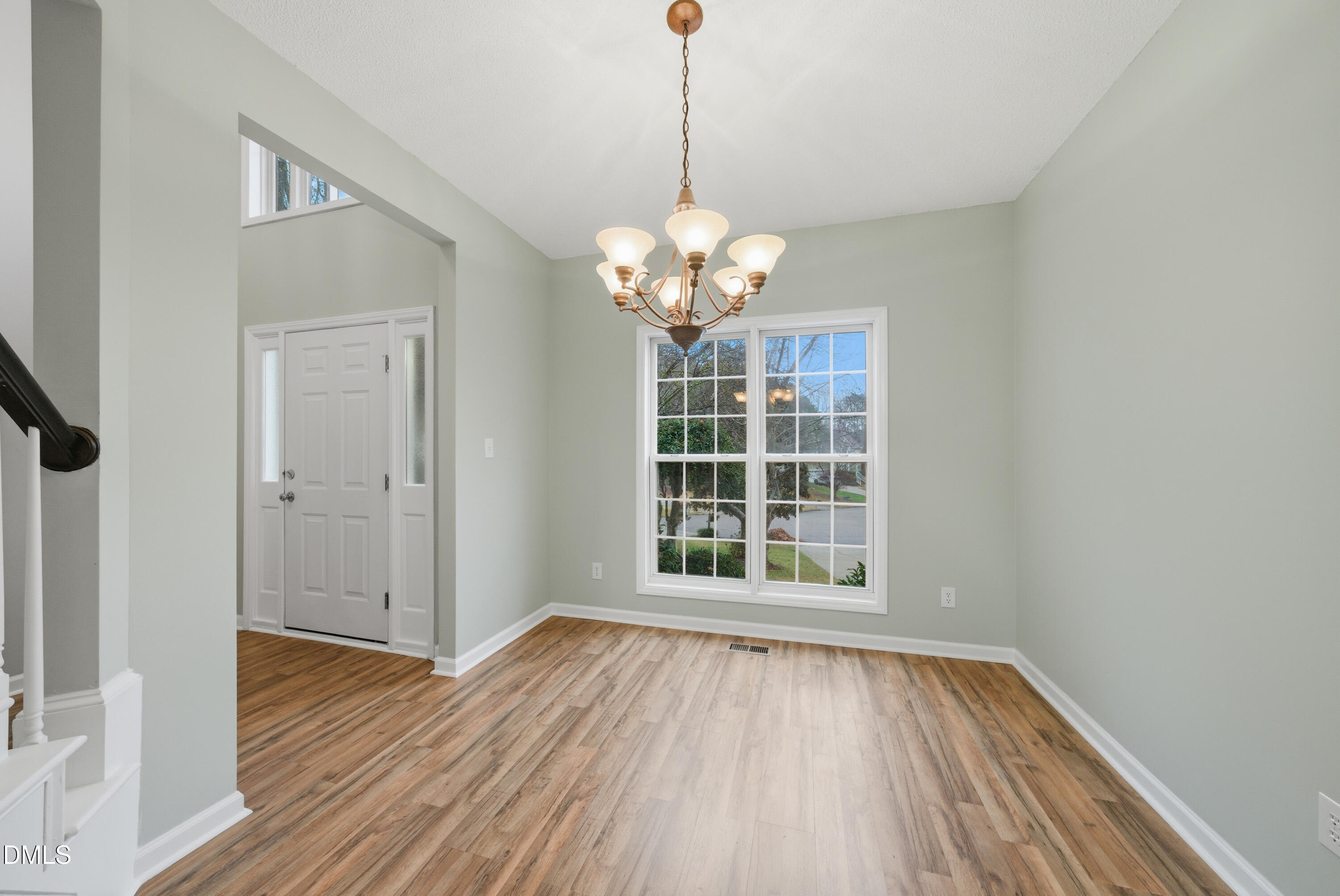 3100 Countryman Court Wake Forest, NC 27587 - Photo 5 of 42 a view of an empty room with wooden floor and a window