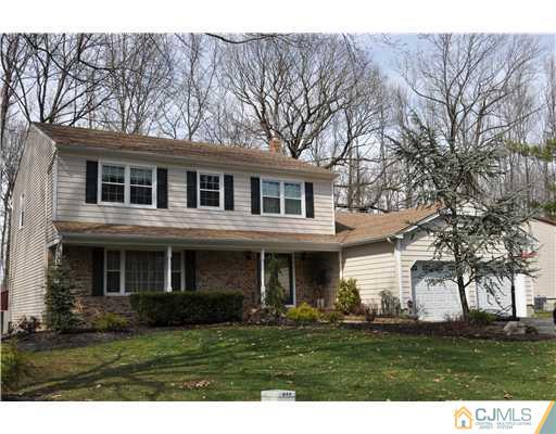 24 Fox Hill Road Edison, NJ 08820 - Photo 1 of 10 a front view of a house with a garden