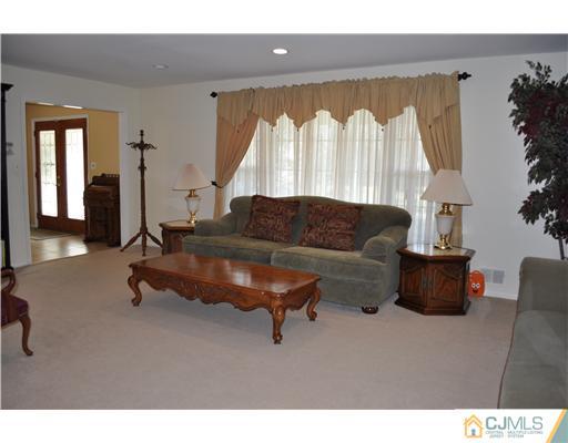 24 Fox Hill Road Edison, NJ 08820 - Photo 2 of 10 a living room with furniture and a large window