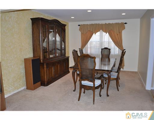 24 Fox Hill Road Edison, NJ 08820 - Photo 4 of 10 a view of a dining room with furniture and wooden floor