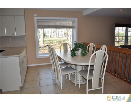 24 Fox Hill Road Edison, NJ 08820 - Photo 6 of 10 a view of a dining room with furniture and window