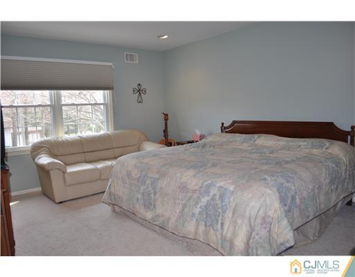 24 Fox Hill Road Edison, NJ 08820 - Photo 9 of 10 a bedroom with two beds and a large window
