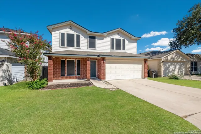 front view of a house with a yard