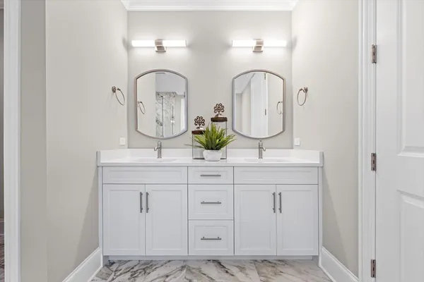 a bathroom with a bathtub and shower