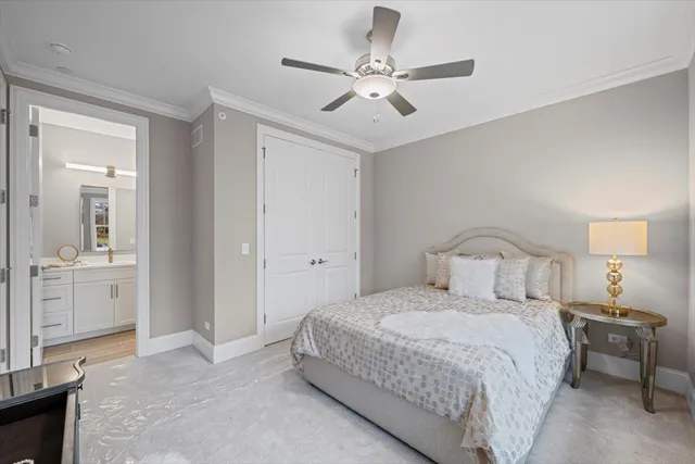 a spacious bedroom with a bed and a large window