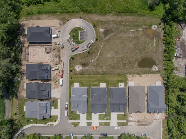 an aerial view of a house with a garden