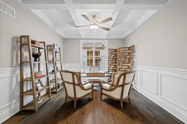 a view of a livingroom with furniture and a window
