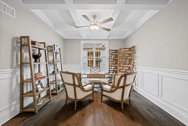 a view of a livingroom with furniture and a window