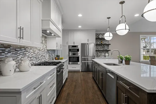 a kitchen with a sink and stove