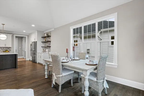 a view of a dining room with furniture and wooden floor