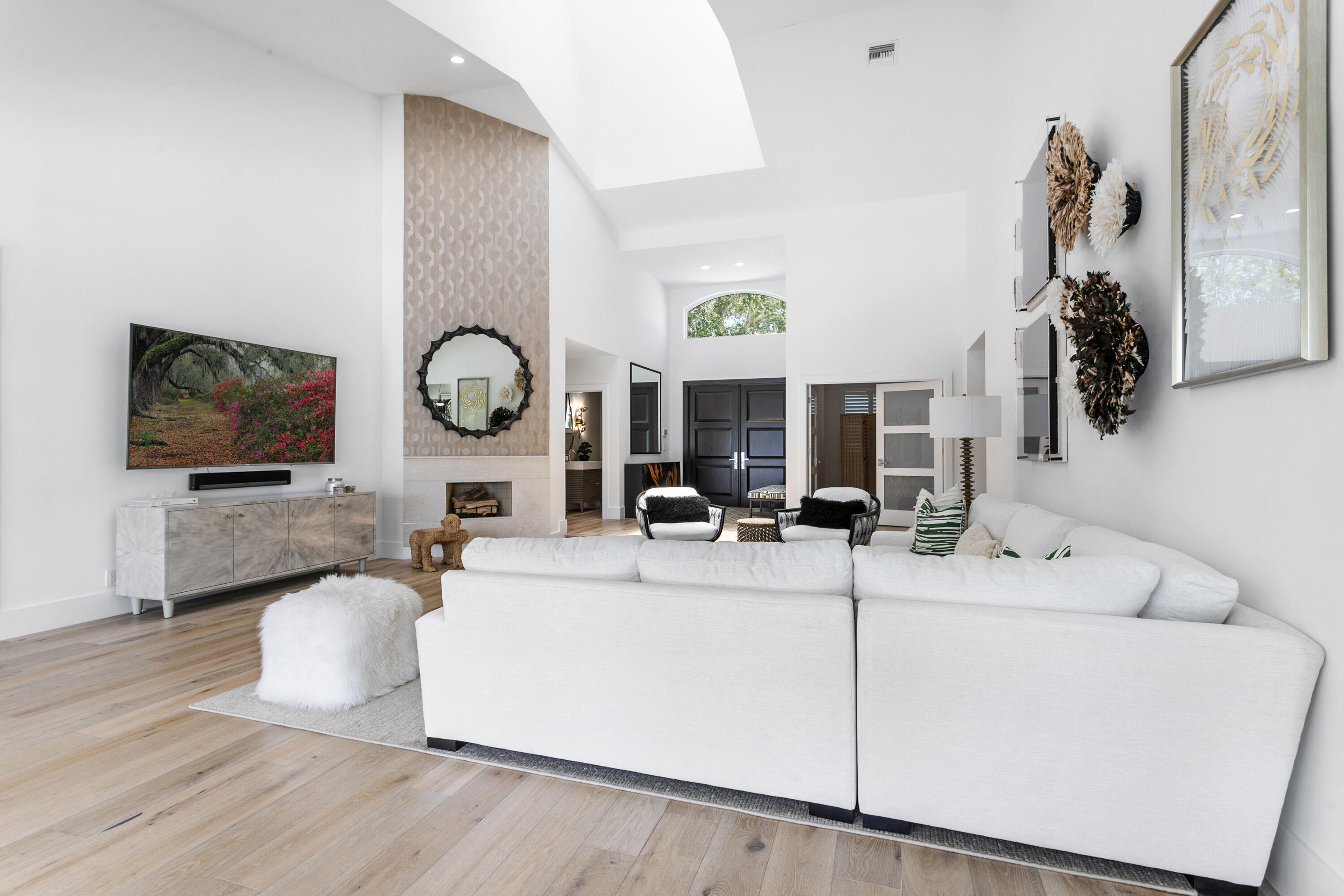 215 Island Drive Jupiter, FL 33477 - Photo 6 of 39 a living room with furniture and a flat screen tv