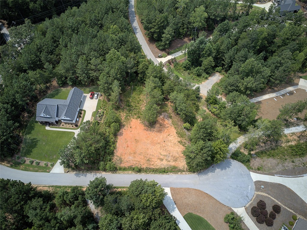 Lot 24 Reservoir Road West Union, SC 29696 - Photo 5 of 46 An aerial perspective reveals a substantial residential lot surrounded by verdant woodlands, poised for new construction.