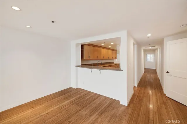 a view of hallway with wooden floor