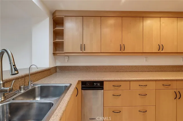 a kitchen with a sink and cabinets