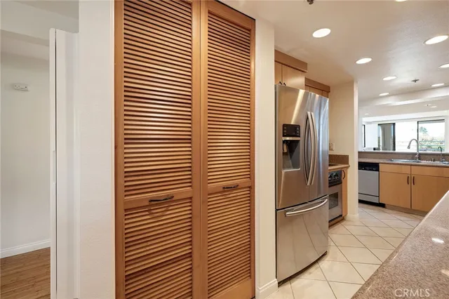 a kitchen with stainless steel appliances a refrigerator and a sink