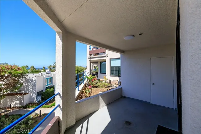 a view of a living room and a balcony