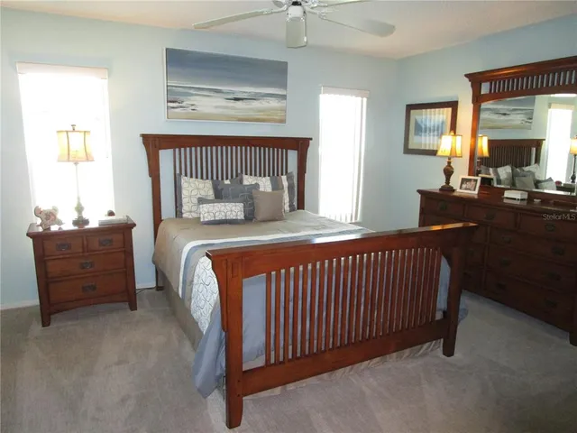 a kitchen with stainless steel appliances a refrigerator a stove a sink and a refrigerator