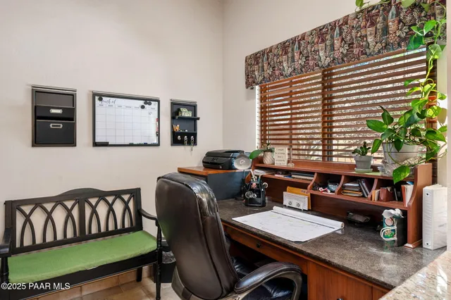a reading room with furniture and a window