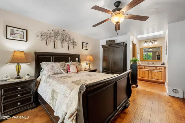 a kitchen with stainless steel appliances a stove a refrigerator and a chandelier