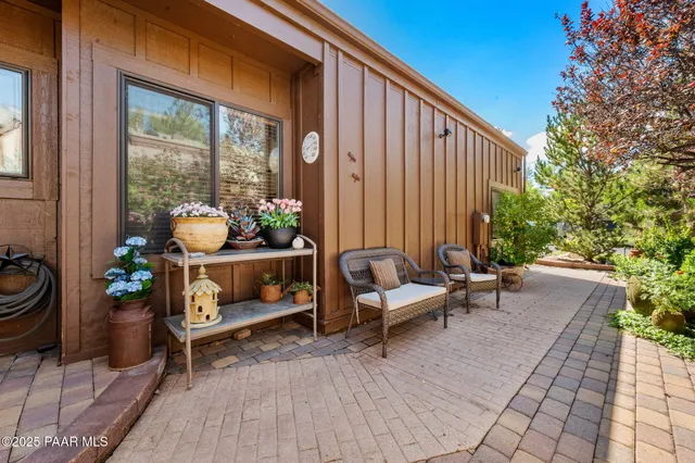 a outdoor living space with furniture and a potted plant