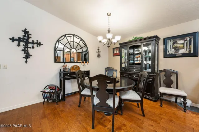 a view of a livingroom with furniture and chandelier