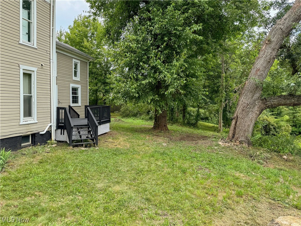 6118 Institute Road Rome, OH 44085 - Photo 24 of 27 View of green lawn featuring a deck