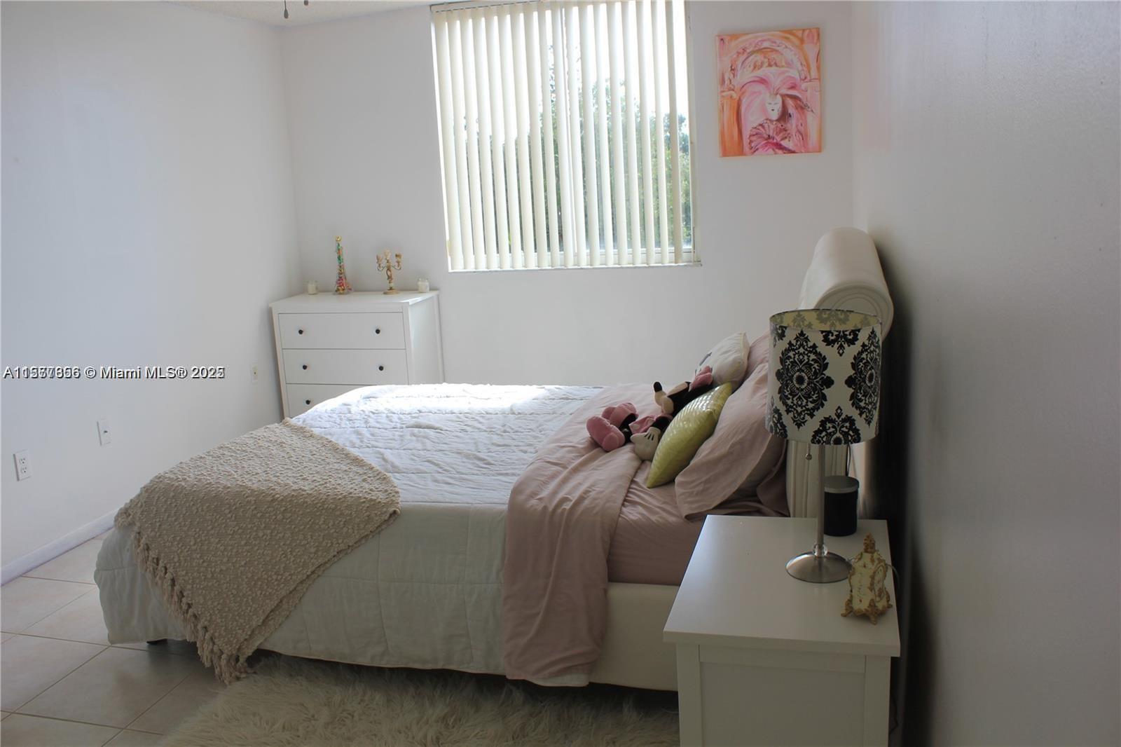 1010 Northwest 11th Street, Unit 601 Miami, FL 33136 - Photo 13 of 35 a bedroom with a bed and a window