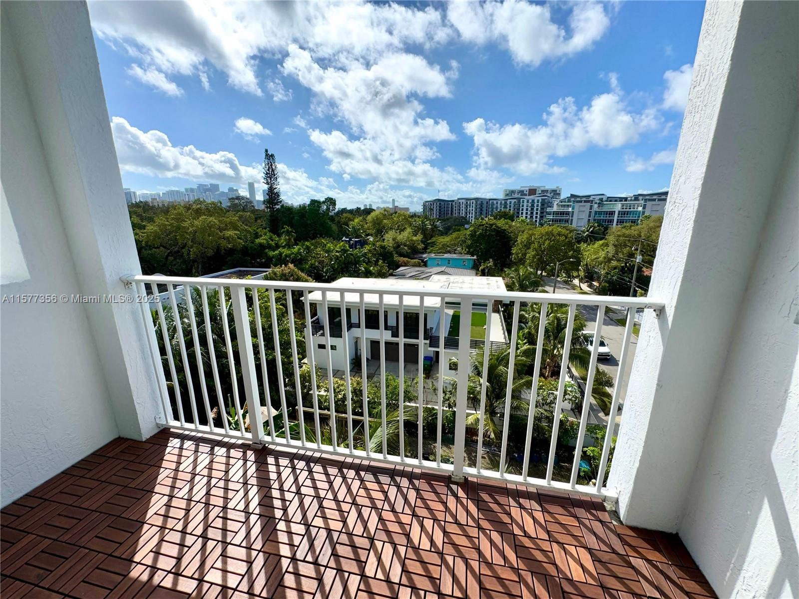 1010 Northwest 11th Street, Unit 601 Miami, FL 33136 - Photo 26 of 35 a view of a balcony with wooden floor