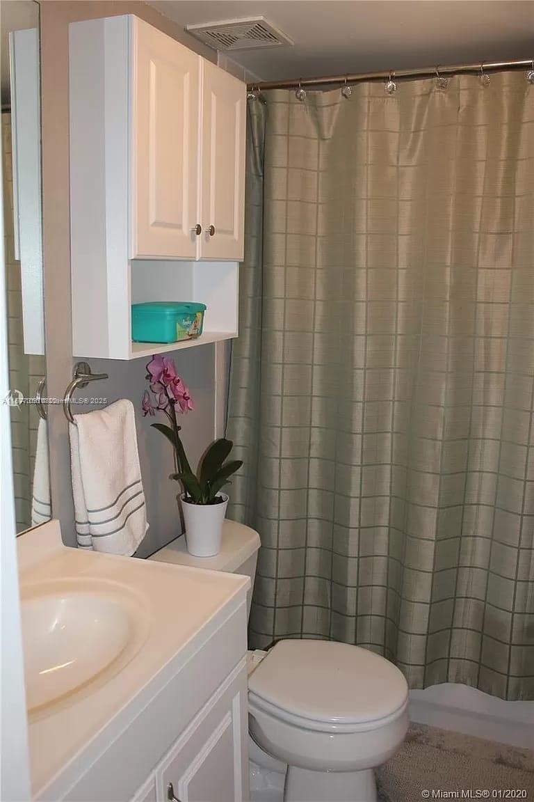 1010 Northwest 11th Street, Unit 601 Miami, FL 33136 - Photo 10 of 35 a bathroom with a sink and toilet