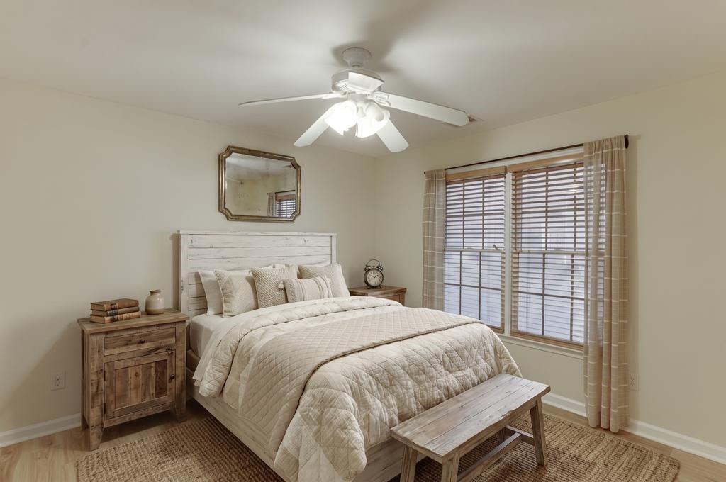 1830 Sanborne Way Dacula, GA 30019 - Photo 11 of 33 a bedroom with a bed and a chandelier