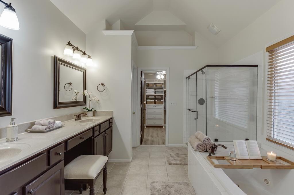 1830 Sanborne Way Dacula, GA 30019 - Photo 16 of 33 a bathroom with a granite countertop sink mirror and a bath tub