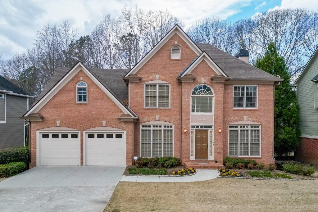 1830 Sanborne Way Dacula, GA 30019 - Photo 22 of 33 a front view of a house with garden