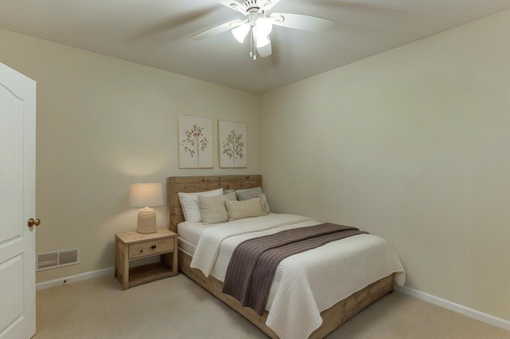 1830 Sanborne Way Dacula, GA 30019 - Photo 9 of 33 a bedroom with a bed and a chandelier