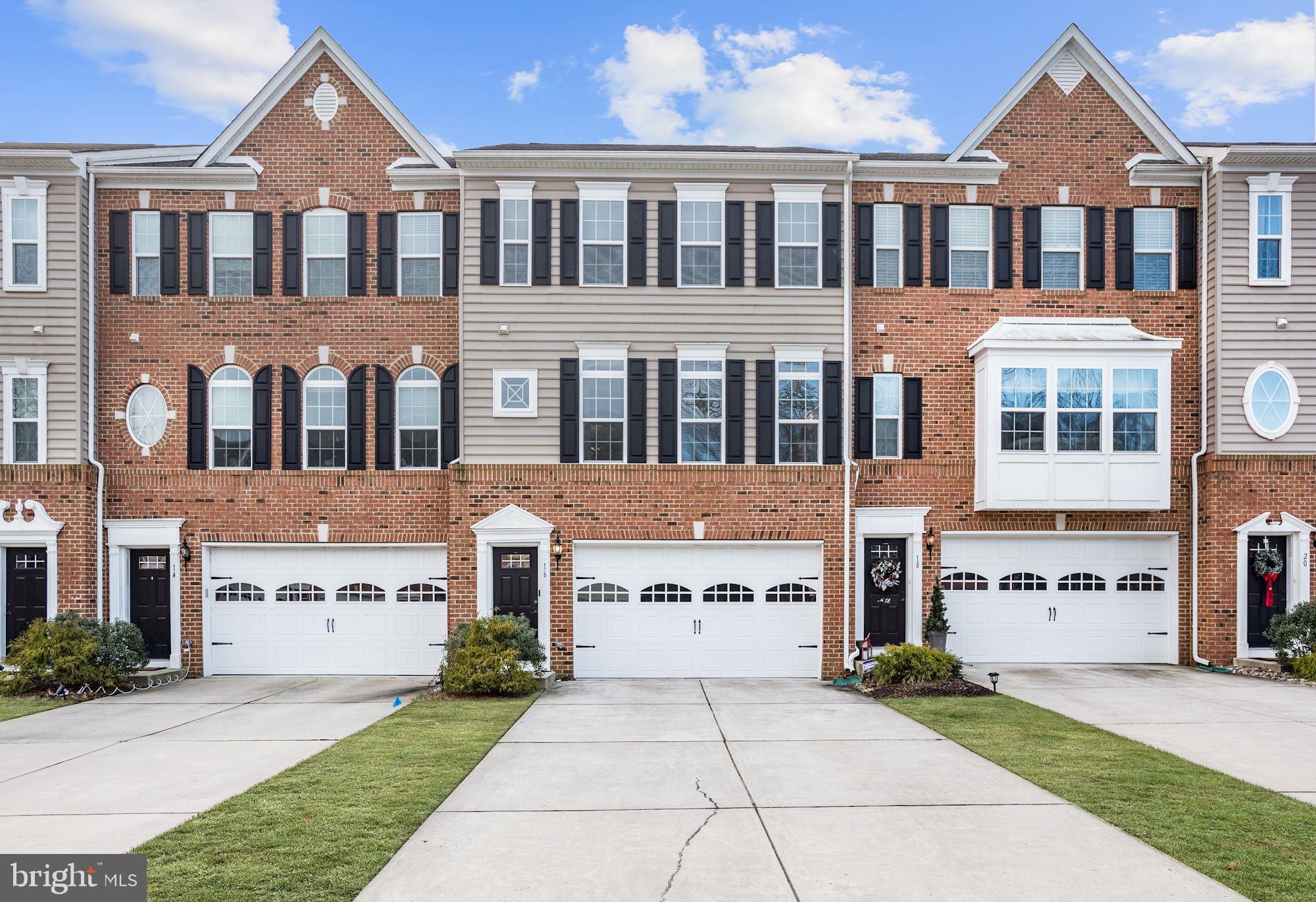Exterior front of townhome with 2 car garage