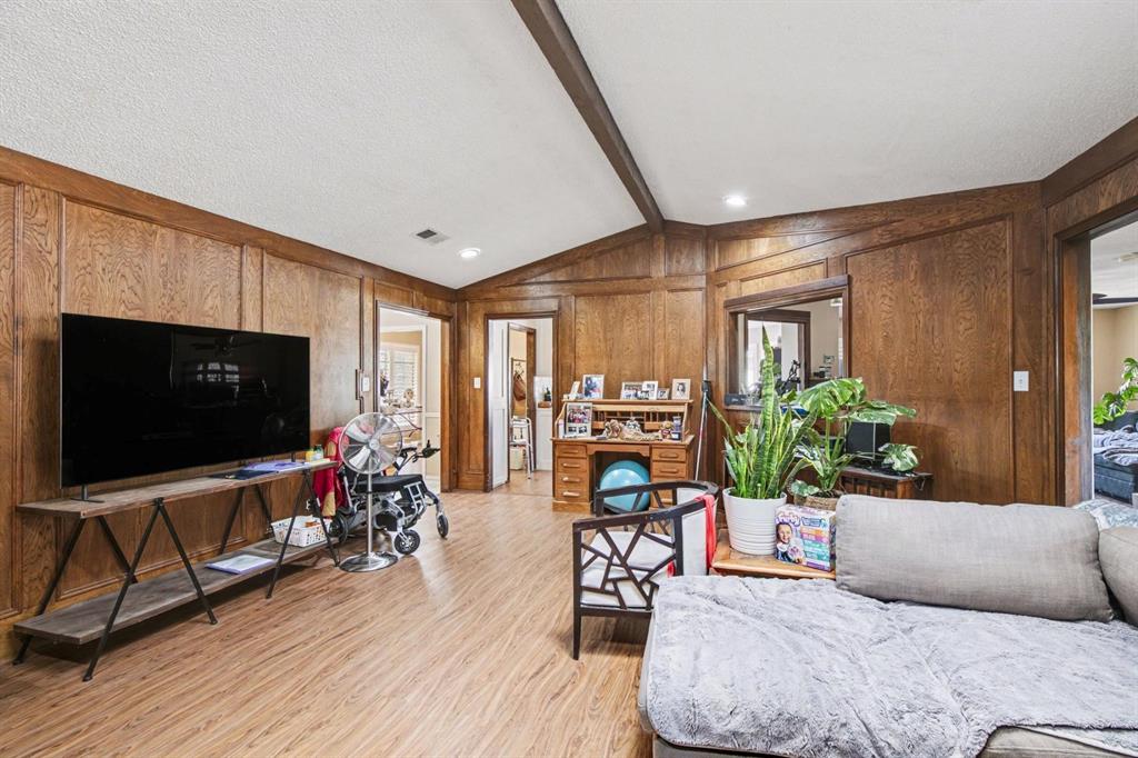 5009 River Ridge Road Arlington, TX 76017 - Photo 13 of 28 a living room with furniture and a flat screen tv